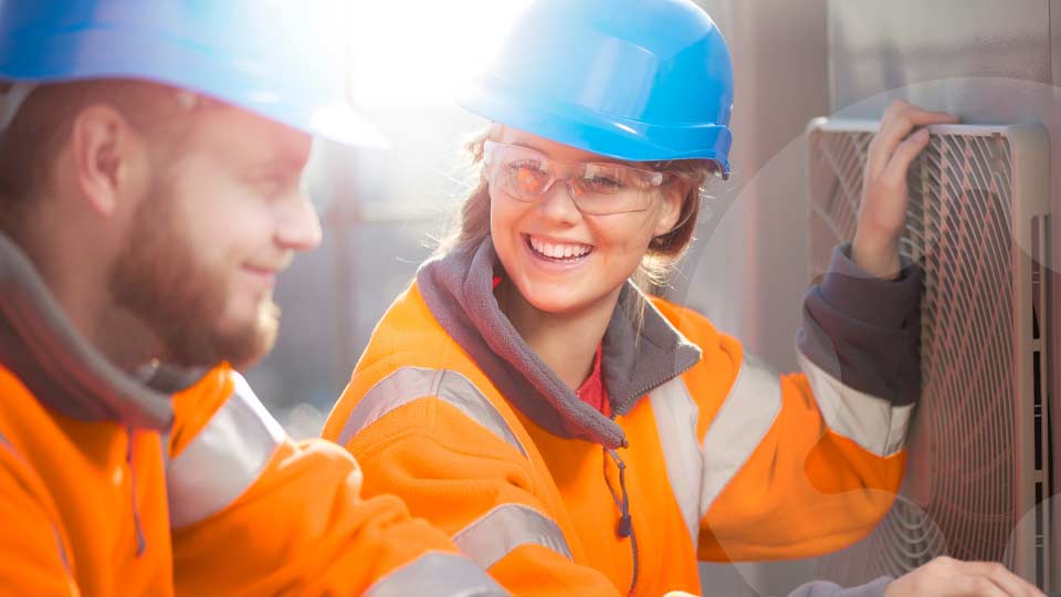 Young people in hi-vis workwear
