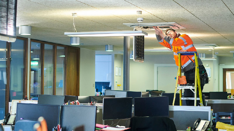 Worker fixing HVAC