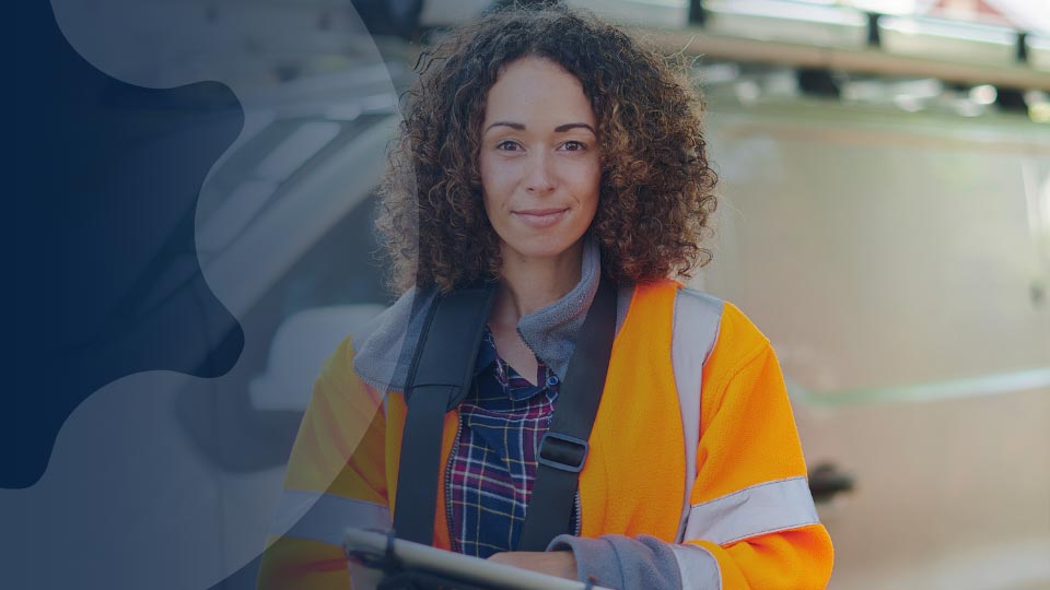 Field service worker in front of van