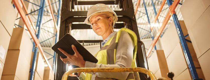 Person at a work site using a tablet device