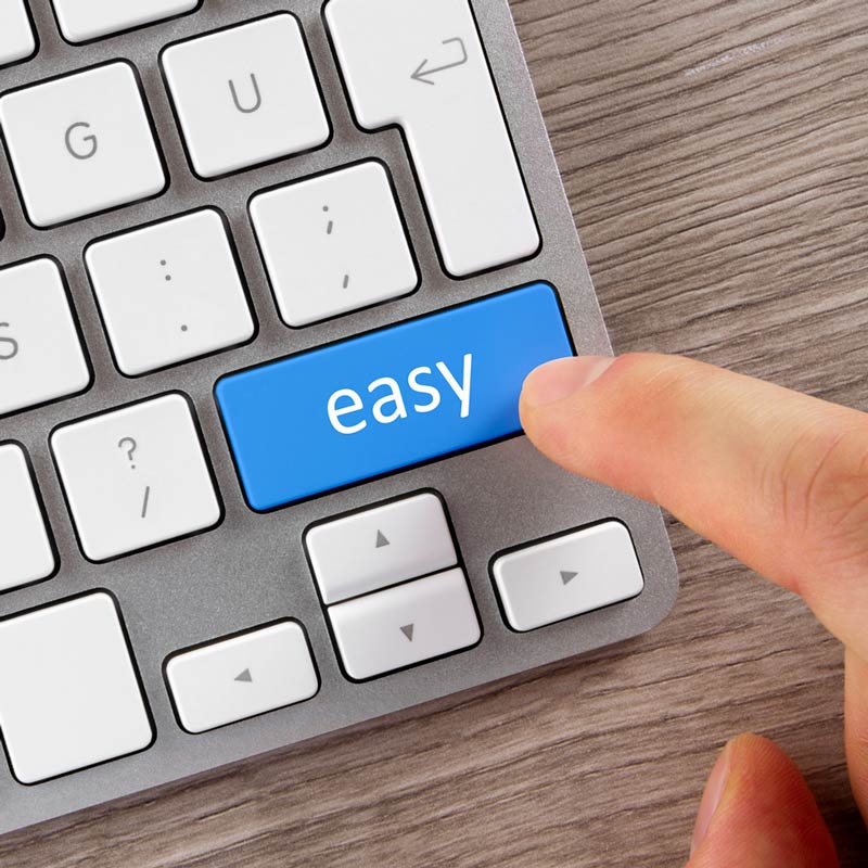 A keyboard is shown with a finger hovering over a key that states the words ‘easy’ on it