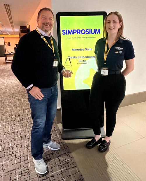 2 people attending the Simprosium conference