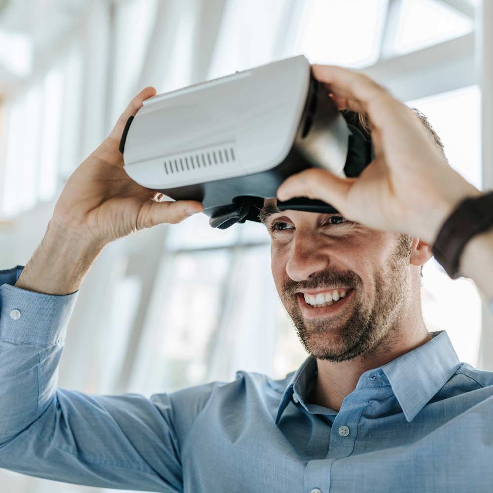 Man smiling using a virtual reality headset