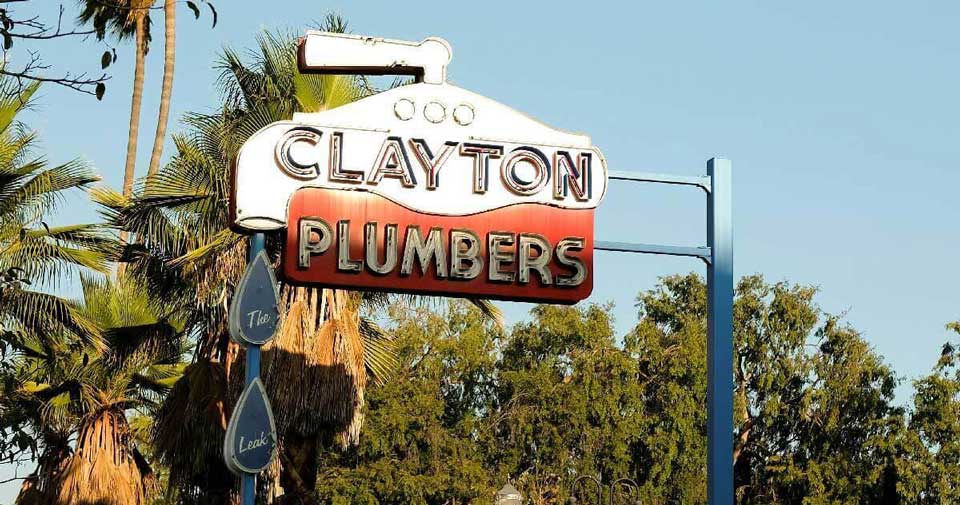 A sign that reads ‘Clayton Plumbers’