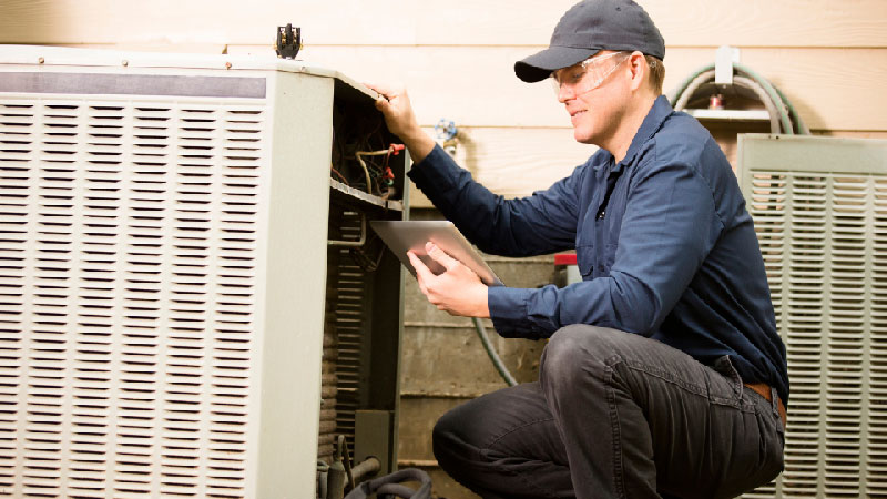 HVAC Worker operating equipment