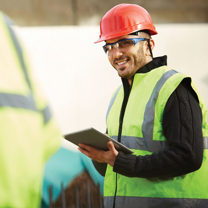 Field service worker using an iPad on site