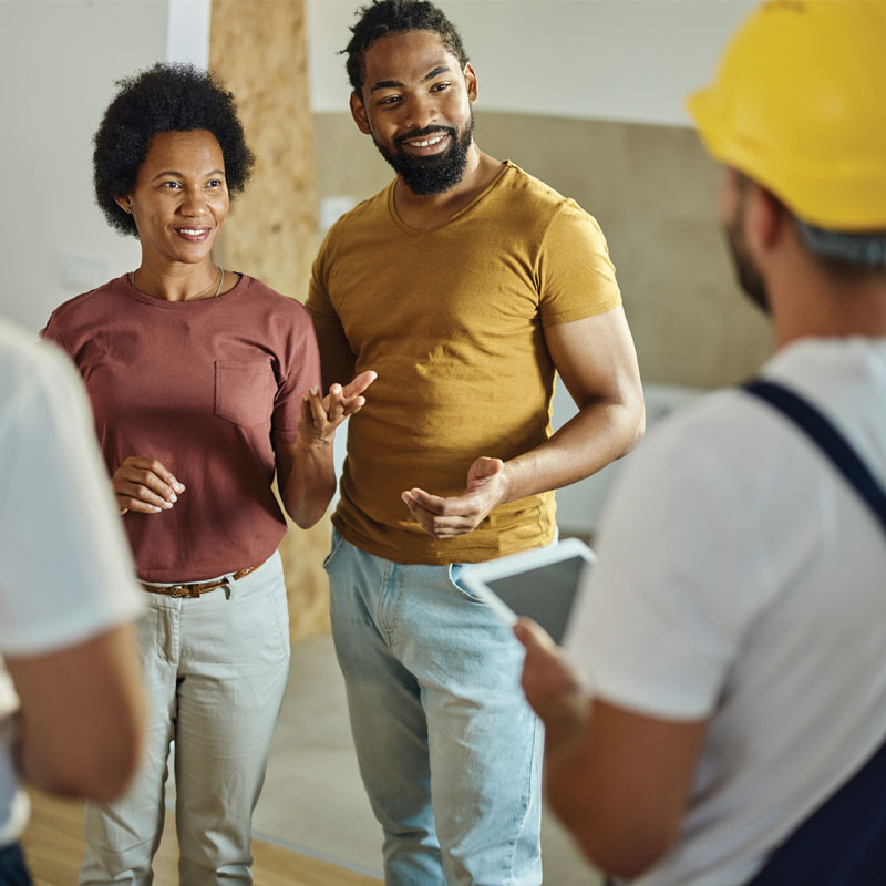 Field service workers talking to customers