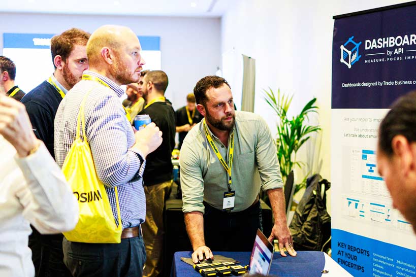 Simprosium attendees checking out the booths