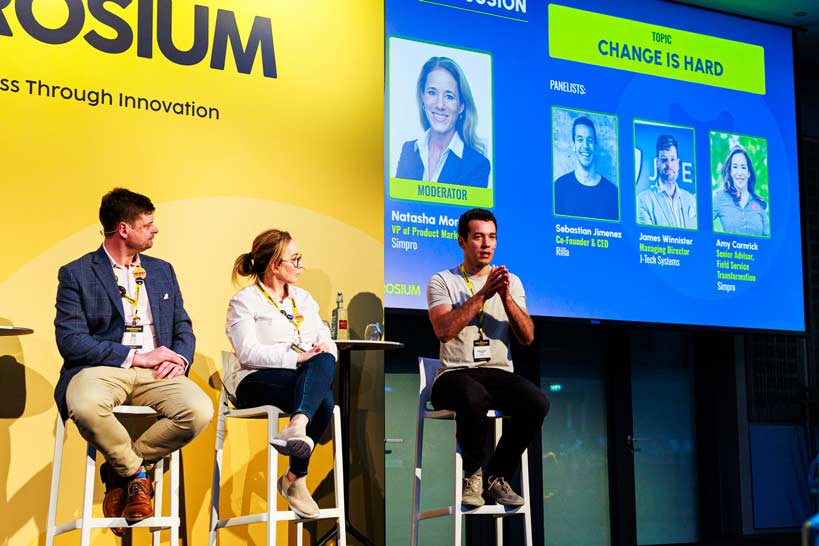 Presenters on stage at Simprosium conference, London, 2025