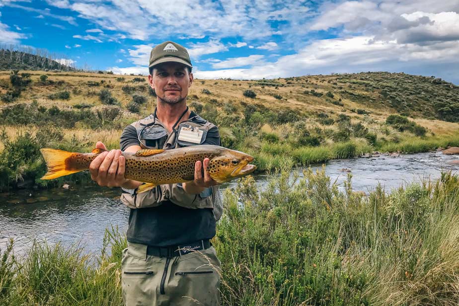 Raynor holding a large trout