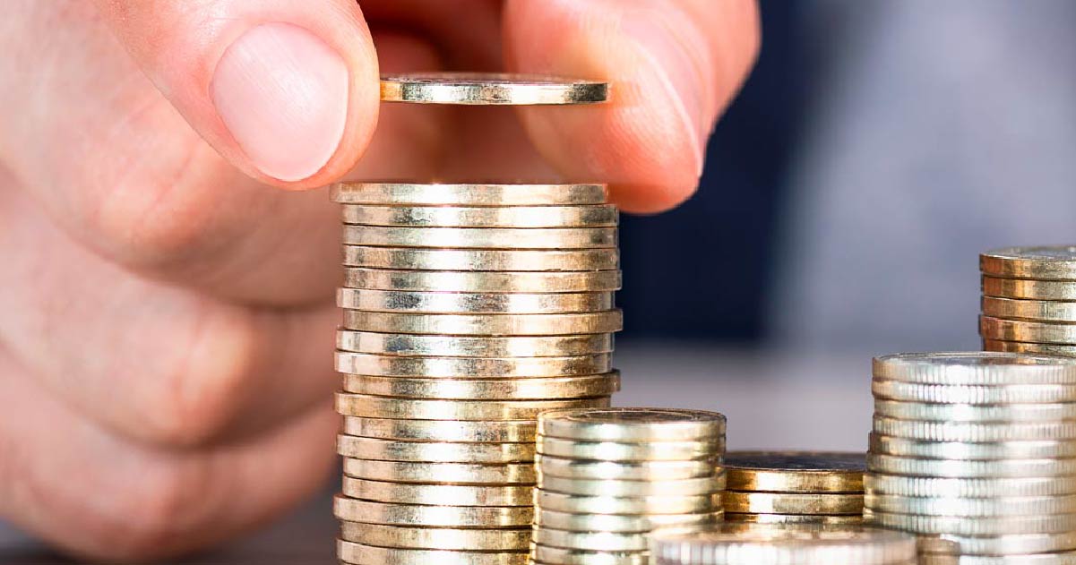 Person stacking coins