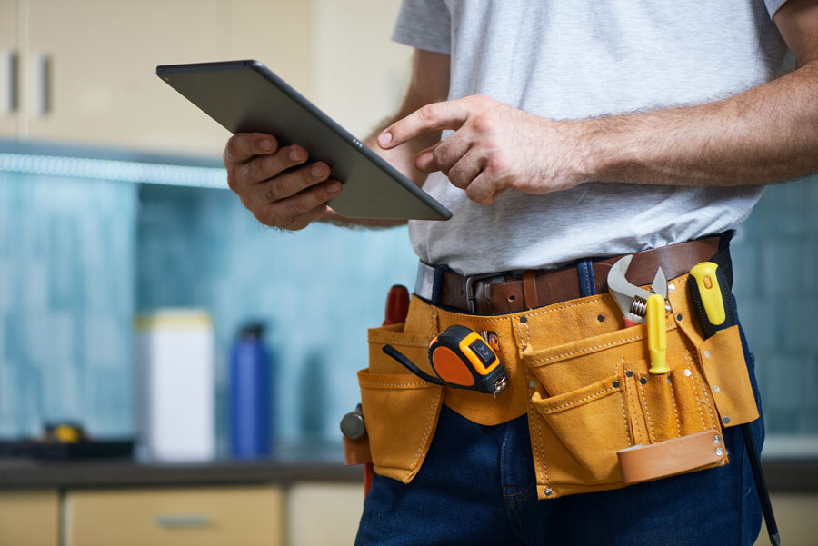 Closeup of person wearing tool belt