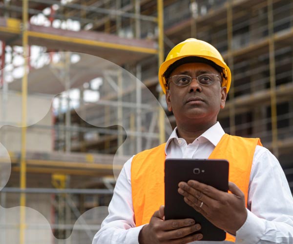 Composition showing device notifications overlaid on photo of worker holding mobile device