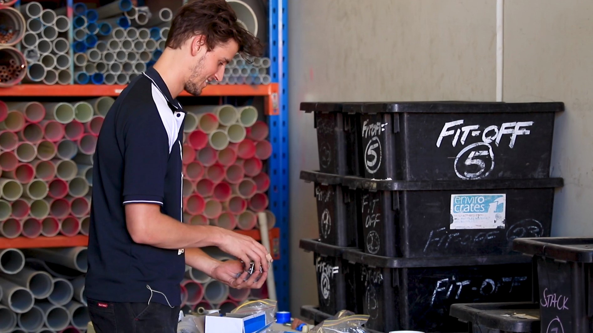 Daly Plumbing worker in a stock warehouse