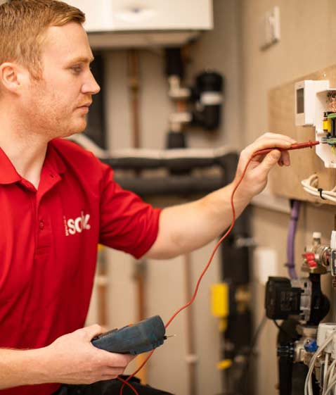 Solv field staff member conducting electrical tests