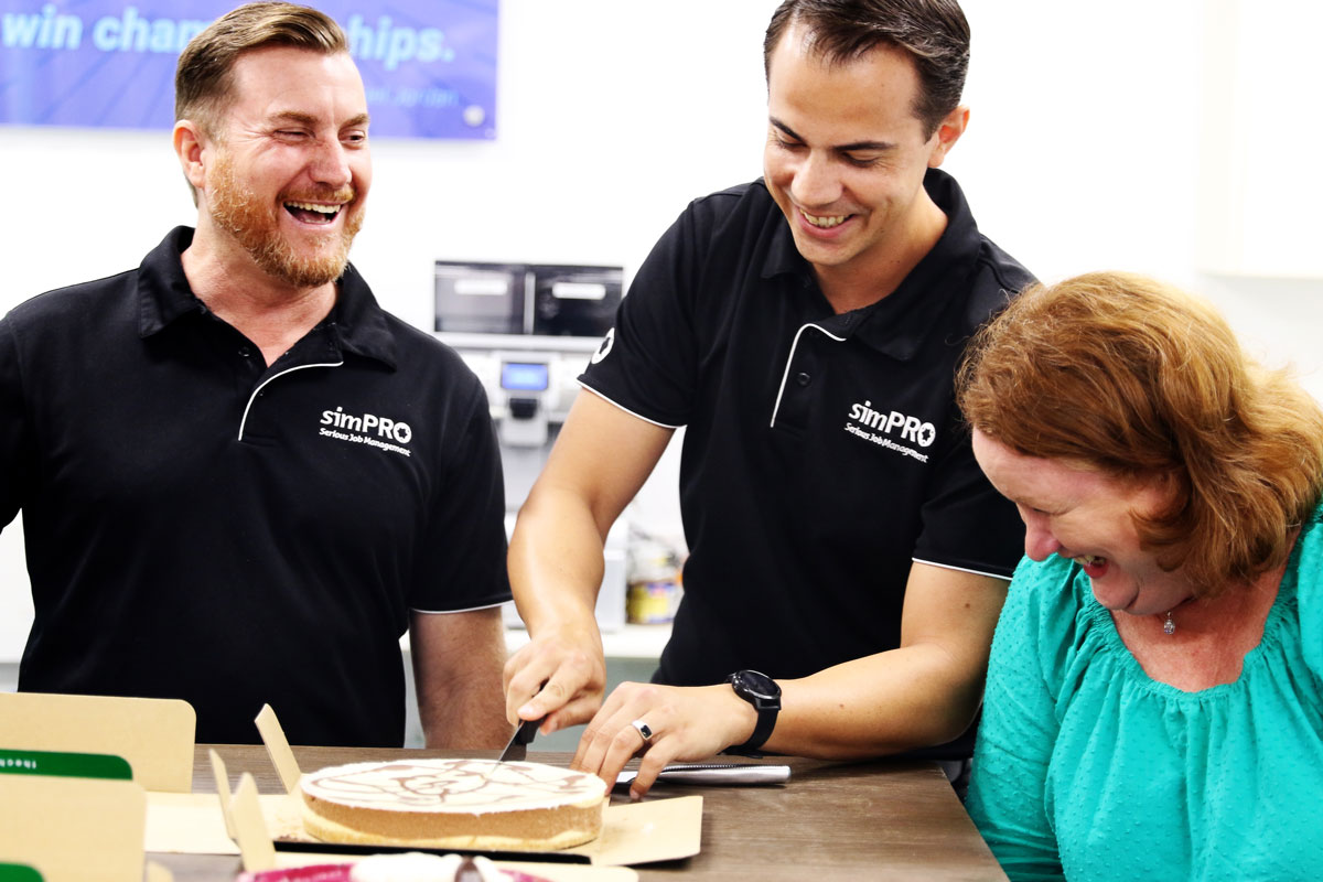 Business Development Manager Ash Parrott and some simPEEPS celebrate his 10 year anniversary with cake.