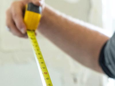 person holding tape measure extended