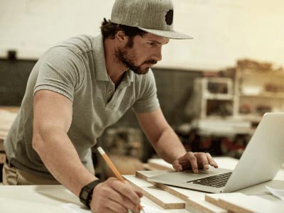 person wearing baseball cap in office setting