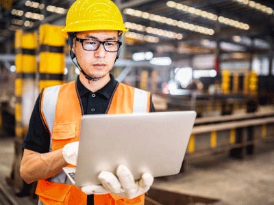 factory worker with laptop