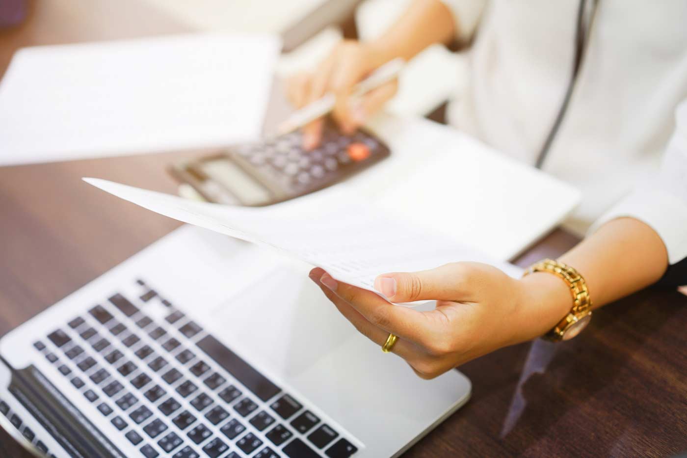 office worker with paper and calculator